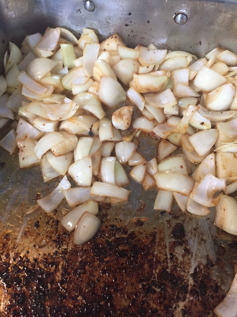 Onions for mirepoix in braising pan. 