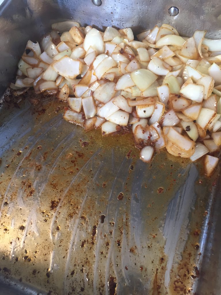 Onions for mirepoix in braising pan. 
