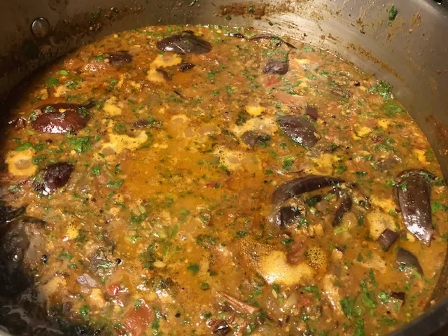Eggplant cooking in curry for Baingan Masala - Bagara Baingan